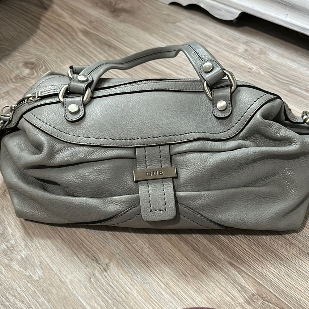 Like new! Gray hobo bag. It’s leather, I think. It’s gorgeous. Not my style.
